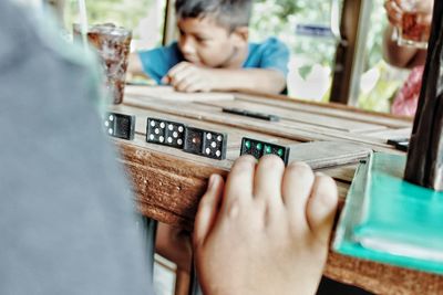 People playing domino on table