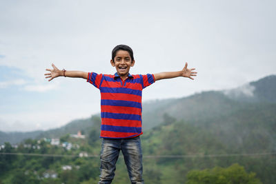 Portrait of a indian pahadi kid who belongs to the mountains. freedom and joy.