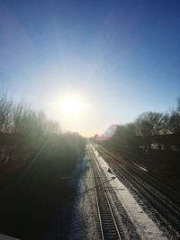 Railway tracks against clear sky