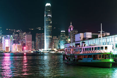 Illuminated buildings in city at night