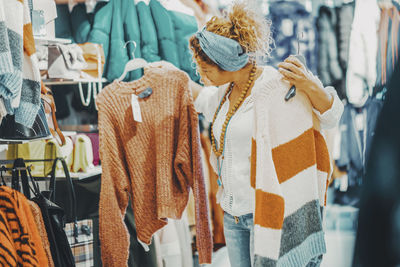 Rear view of woman standing in store