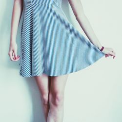 Low section of woman standing on tiled floor