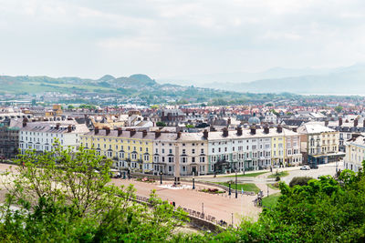 High angle view of buildings in city against sky