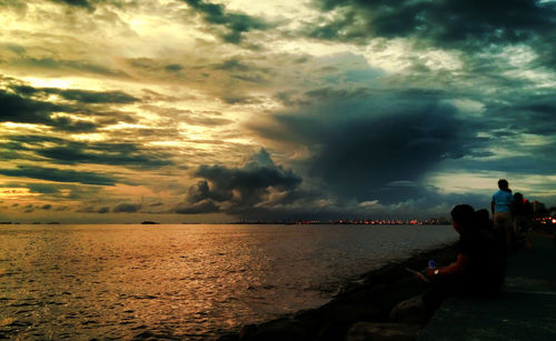 Scenic view of sea against cloudy sky