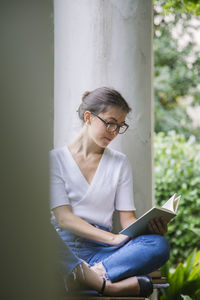 Young woman using mobile phone outdoors