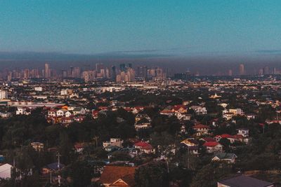 High angle view of buildings in city against sky