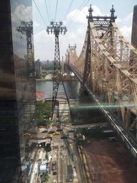 Bridge over river with city in background