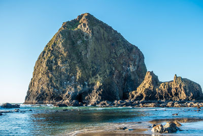 A view of the haystack rock monolith at cannon beach, oregon.