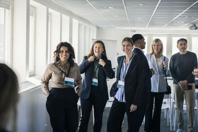 Group of business people smiling during conference break