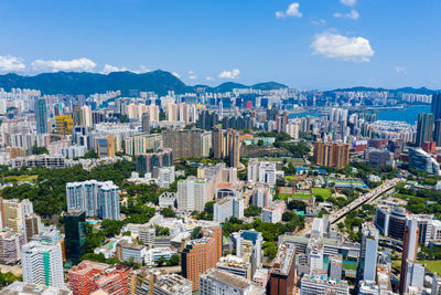 High angle view of buildings in city against sky