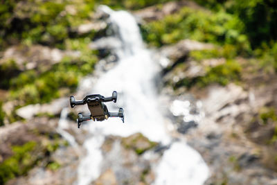 Airplane flying over rocks