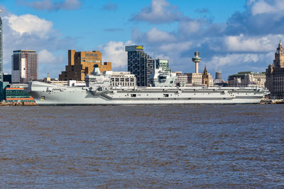 Panoramic view of sea and buildings against sky