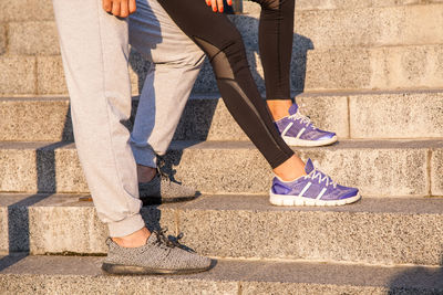 Low section of women wearing shoes