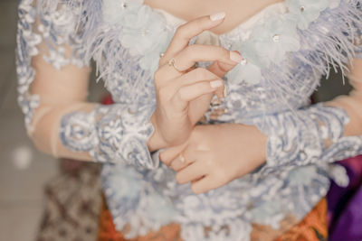 Close-up of woman holding hands