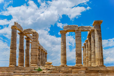 Old ruins of temple against cloudy sky