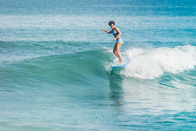 Full length of man surfing in sea