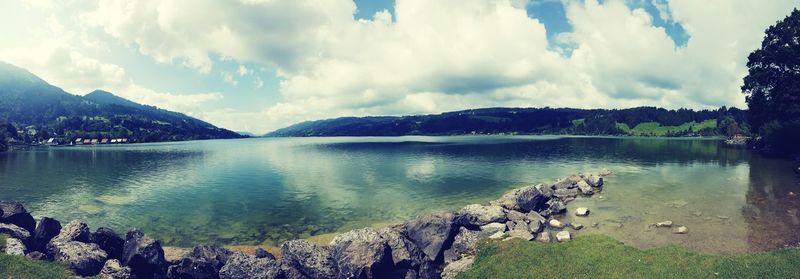 Panoramic view of lake against cloudy sky