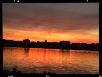 Scenic view of river at sunset