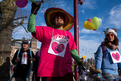 Group of people holding balloons