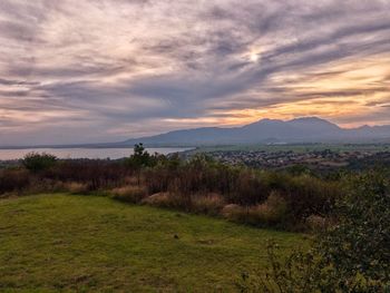 Scenic view of landscape against sky during sunset