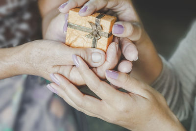 Midsection of woman holding hands