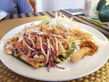 Vegetarian food concept - pad thai noodles served with cayenne pepper