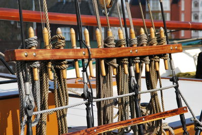 Close-up of ropes hanging on sailboat