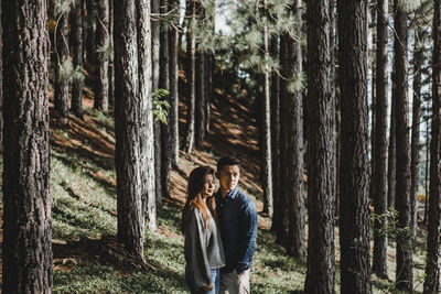 Panoramic shot of people walking in forest