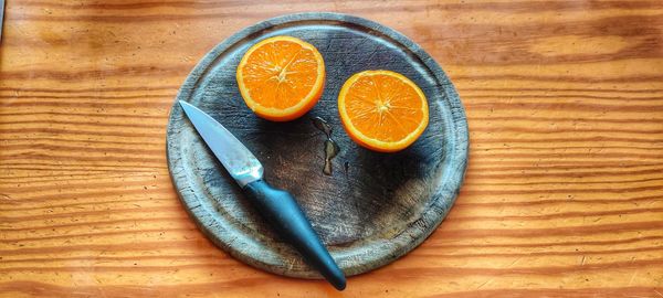 High angle view of orange slices on cutting board