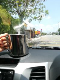 Man holding glass of car