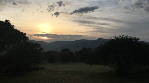 Scenic view of silhouette trees against sky during sunset