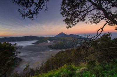 Scenic view of landscape against sky during sunset