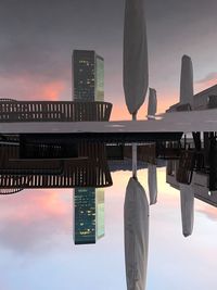 Low angle view of skyscrapers against sky during sunset