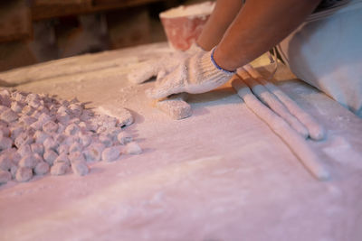 Low section of woman standing on table