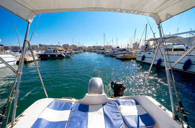 Rear view of man on boat sailing in sea