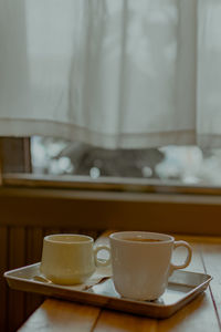 Close-up of coffee cup on table