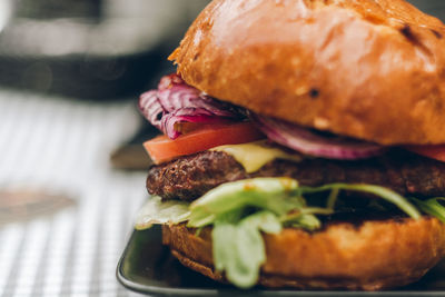 Close-up of hamburger in tray on table