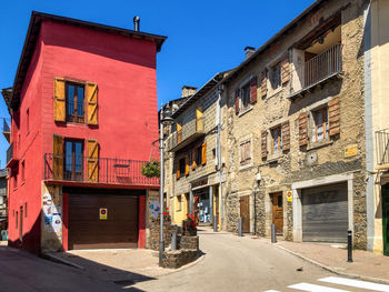 Street amidst buildings in town against clear sky, in llívia. 