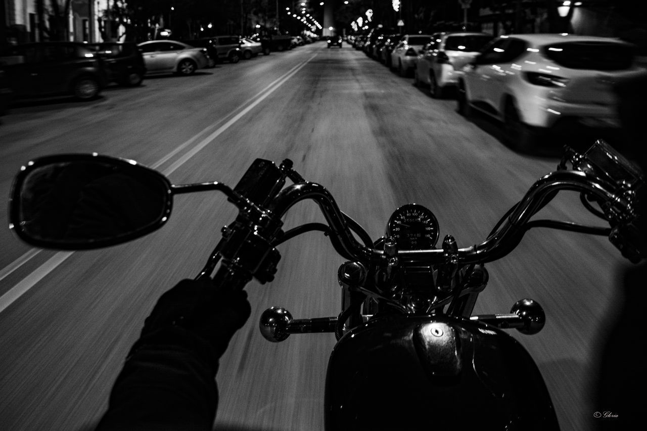 MAN RIDING BICYCLE ON STREET