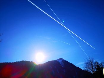 Low angle view of vapor trails in sky