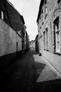 Alley amidst buildings in city