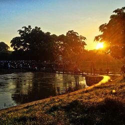 Scenic view of river at sunset