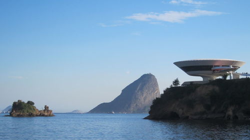 Scenic view of sea with mountains in background