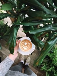 Woman holding coffee cup