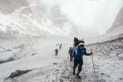 People on mountain during winter