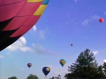 Low angle view of hot air balloon against blue sky