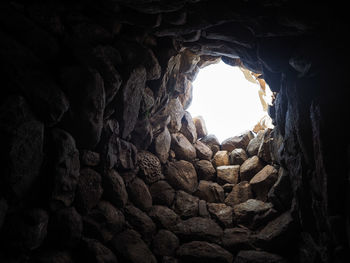 Low angle view of rock formation against sky