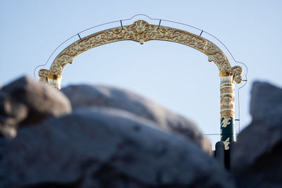 Low angle view of arch against sky