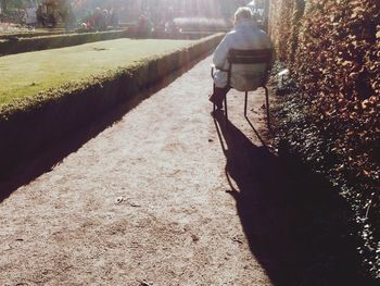 Rear view of man walking on street