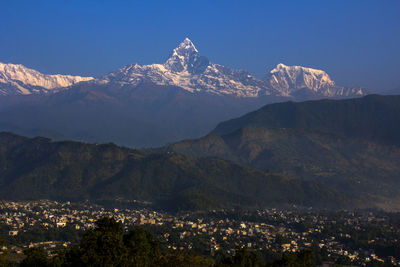 Scenic view of mountains against sky at night